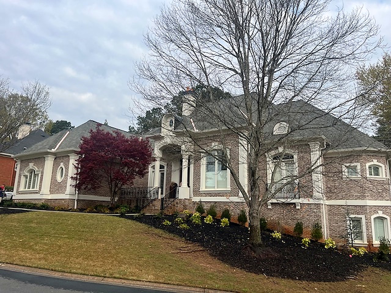 Slate-style re-roof, stucco estate